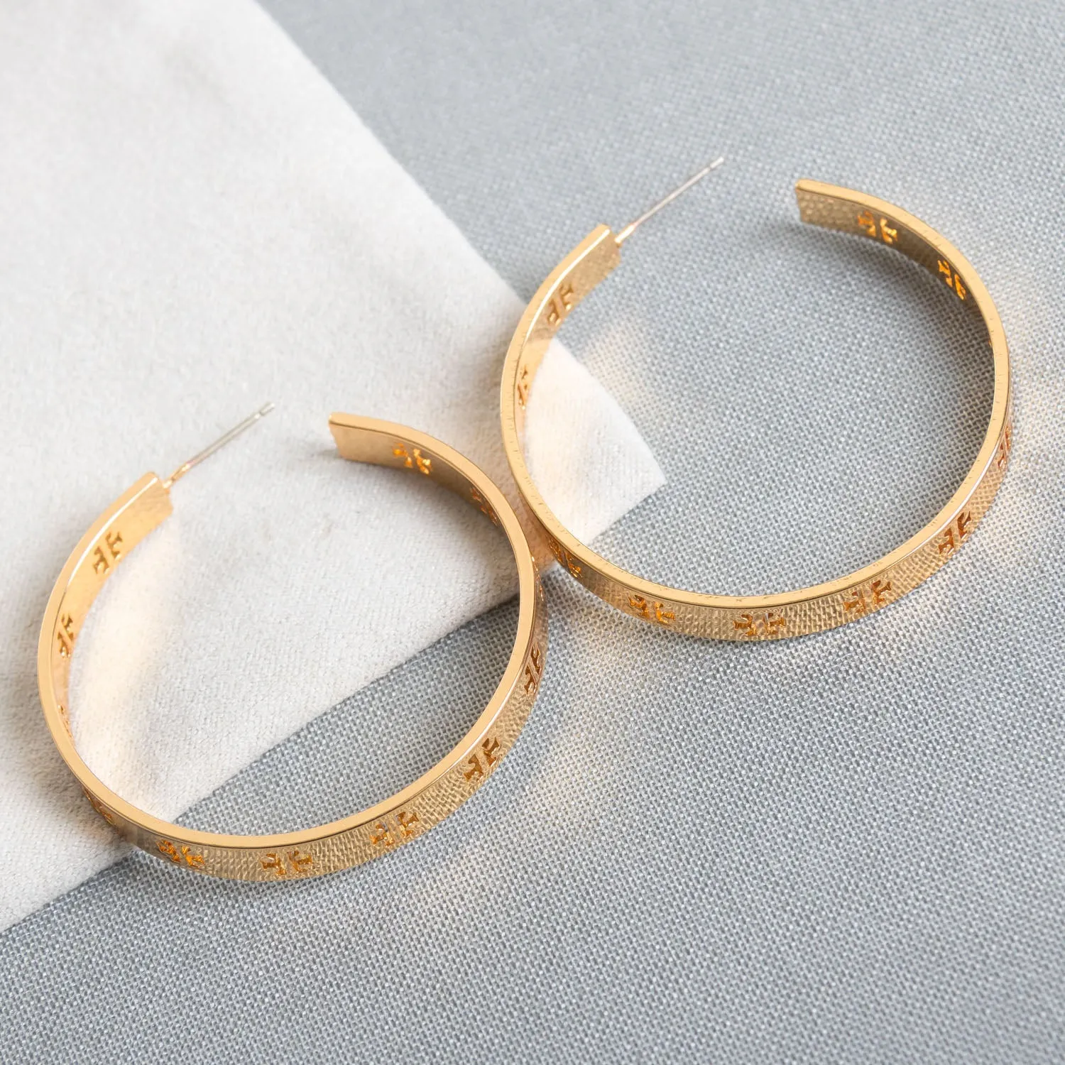 Gold Pierced “T” Logo Hoop Earrings