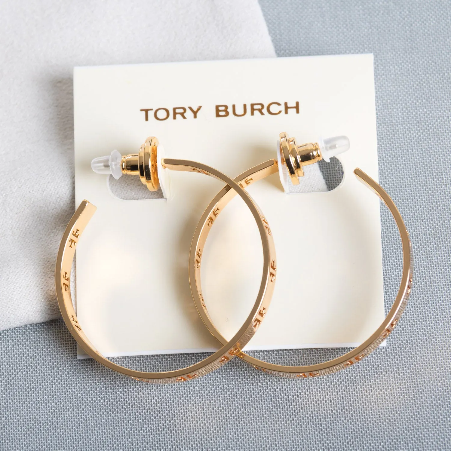 Gold Pierced “T” Logo Hoop Earrings