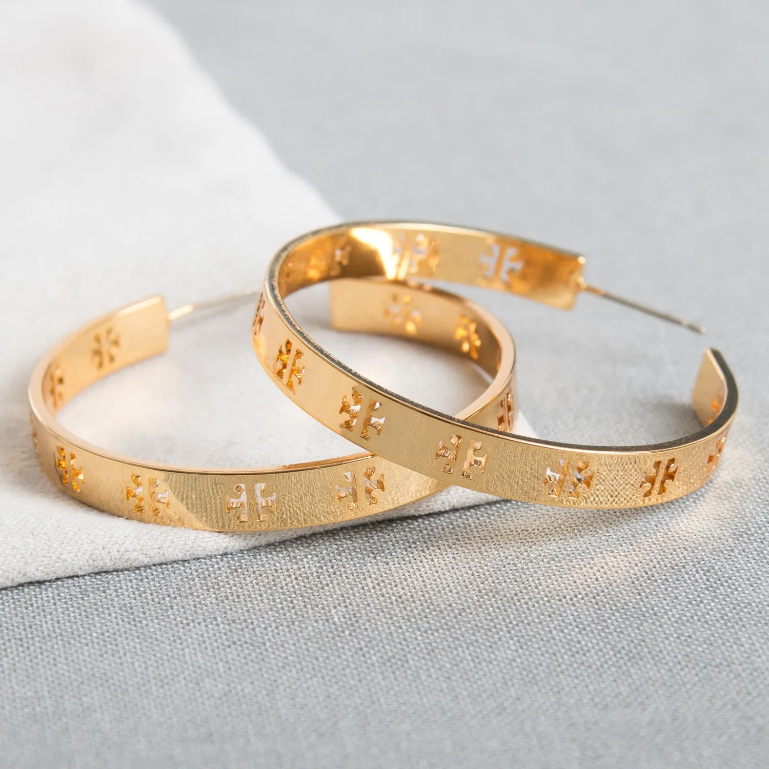 Gold Pierced “T” Logo Hoop Earrings