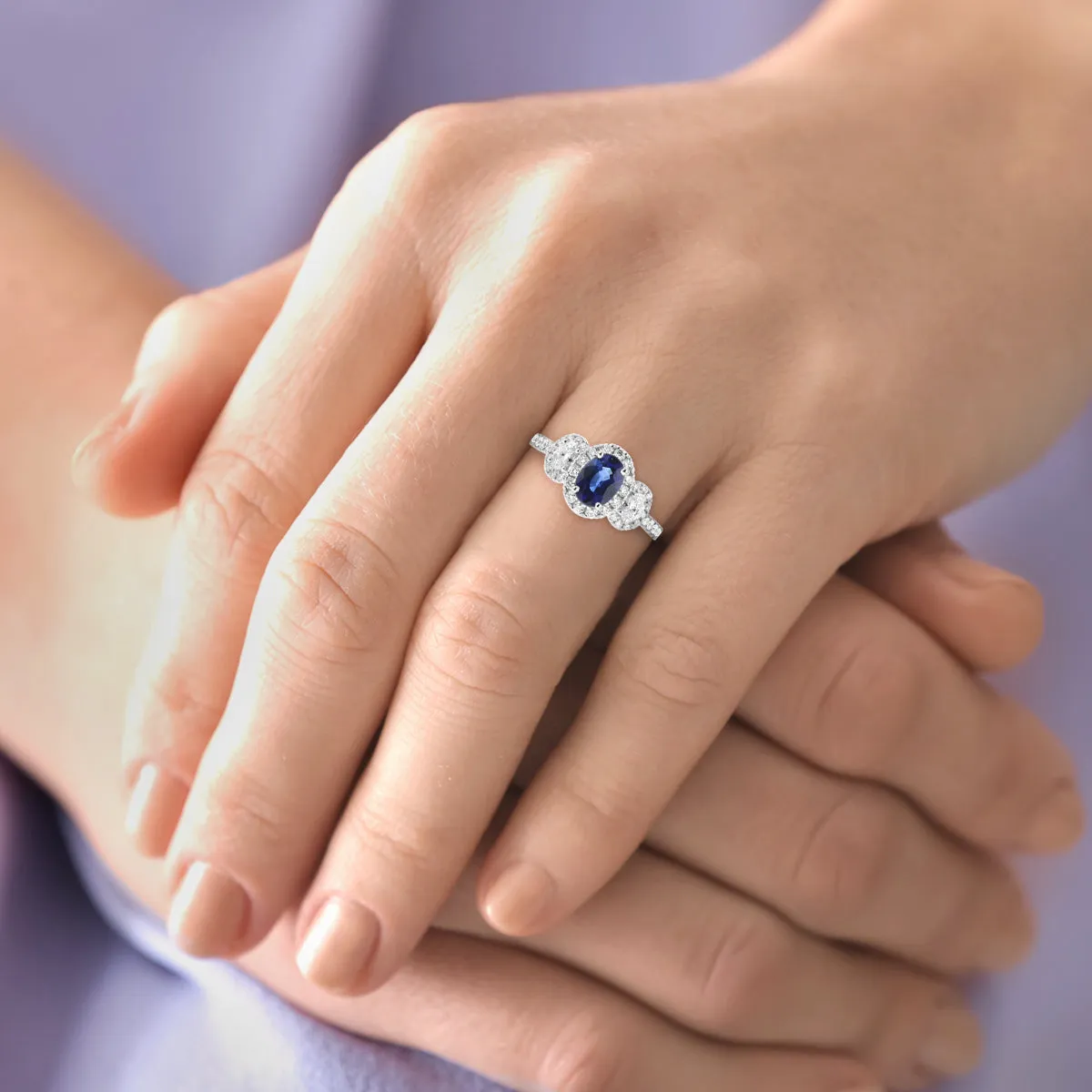 Oval Sapphire & Diamond Three Stone Halo Ring