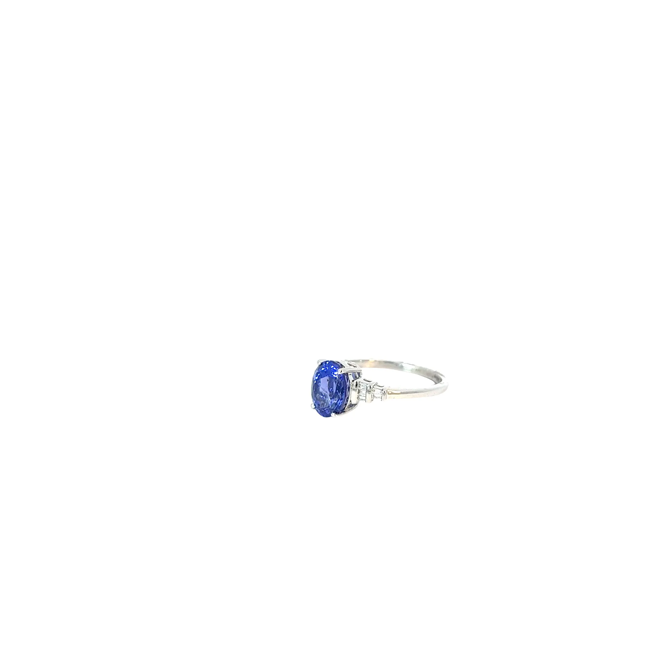 Platinum 1.75ct Oval Tanzanite AAA and .10ct F VS2 Baguette Diamond Ring
