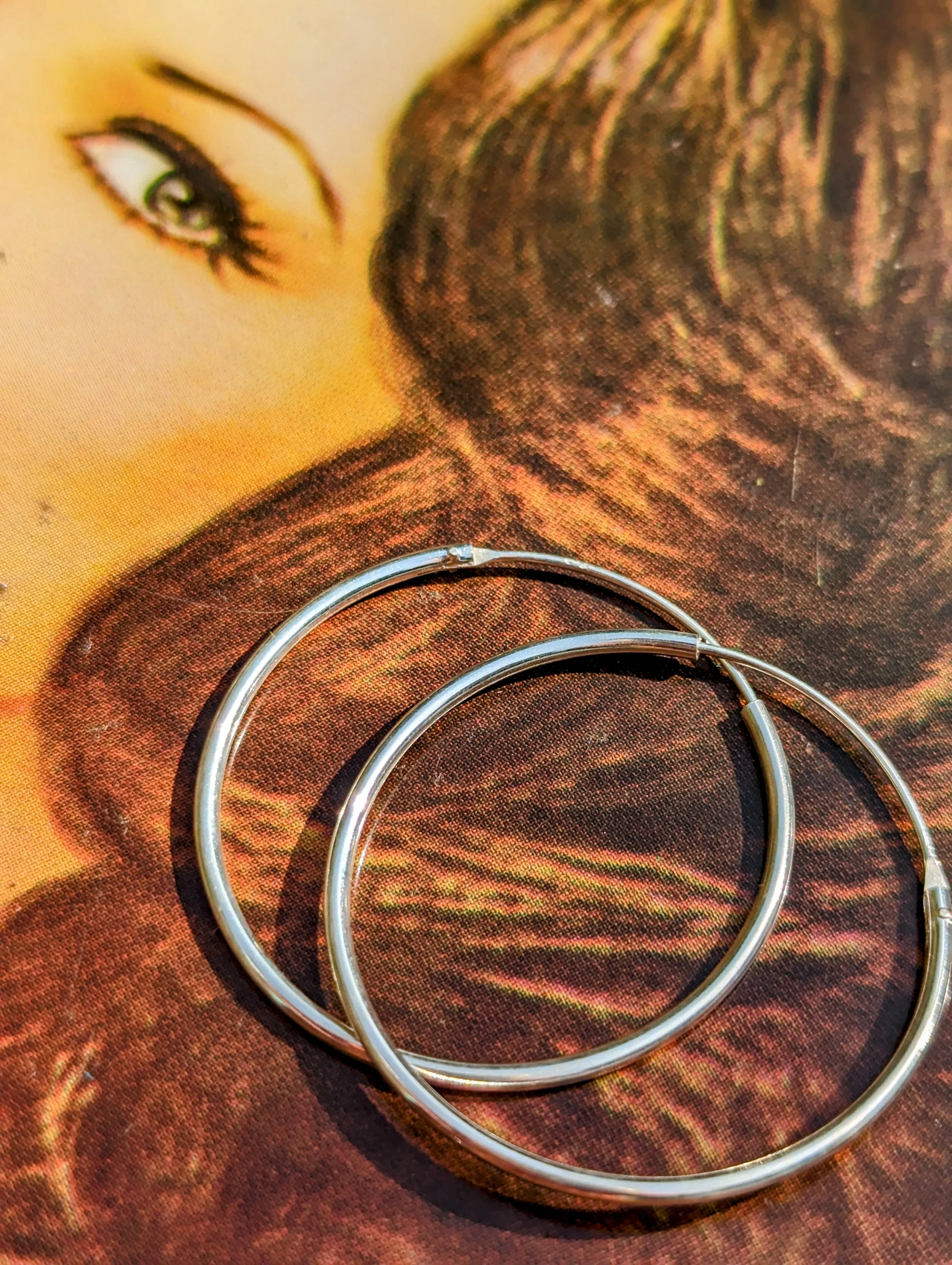 Simple silver hoops