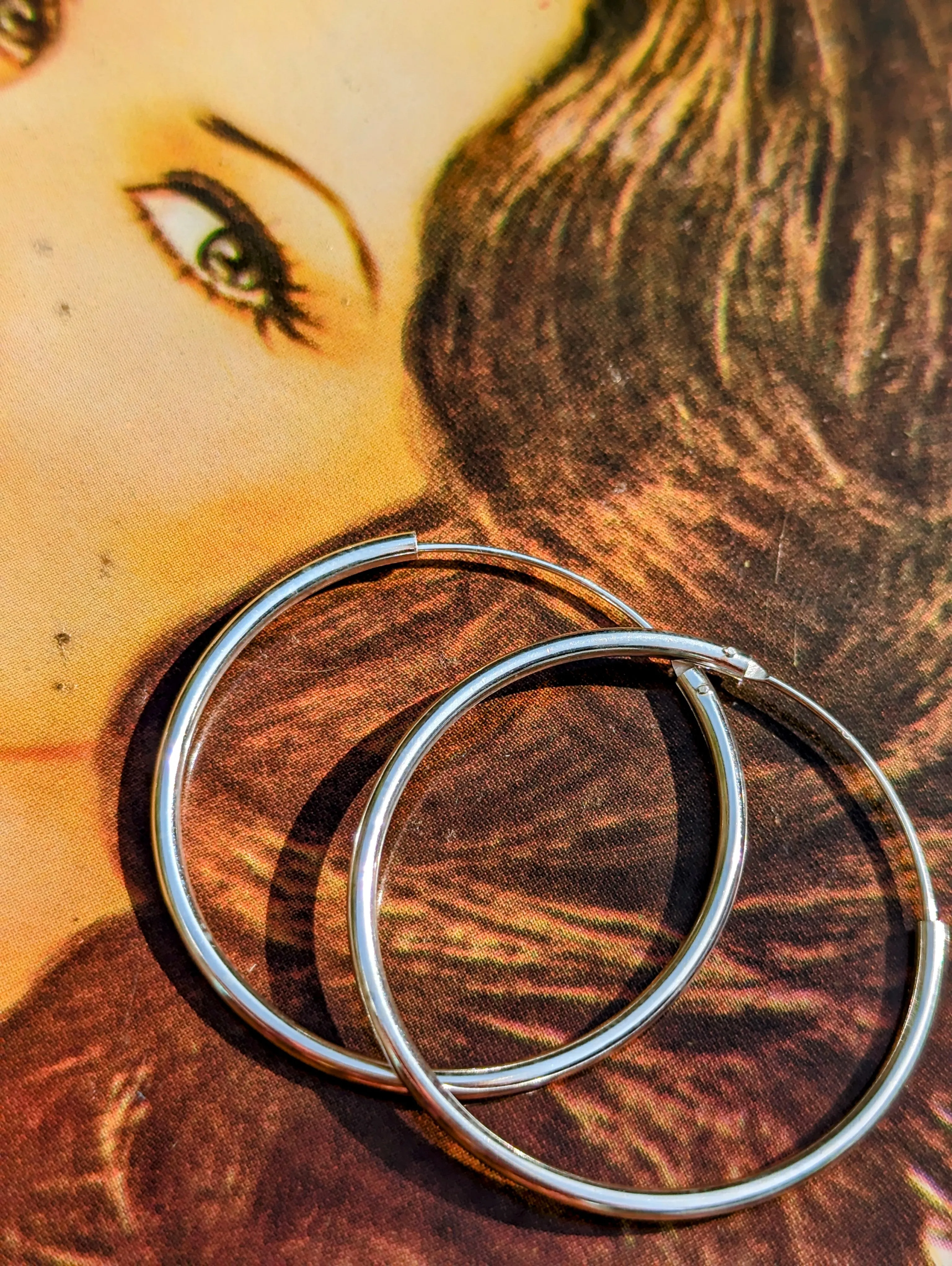 Simple silver hoops